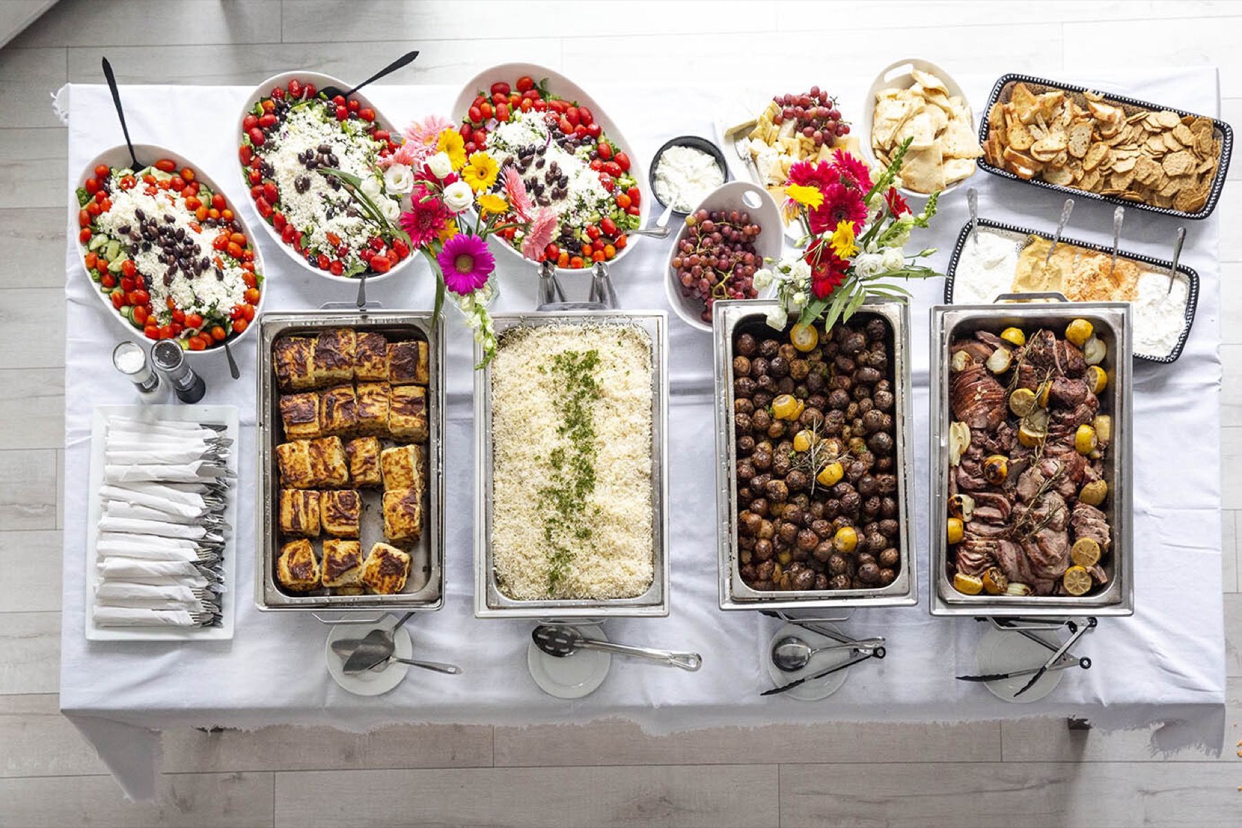 Greek catering trays and platters arranged for a group event